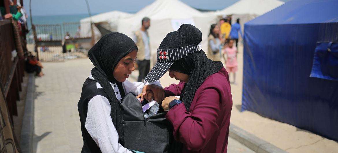 Girls affected by the ongoing conflict in Gaza receive a care and protection package distributed by UNICEF. Girls affected by the ongoing conflict in Gaza receive a care and protection package distributed by UNICEF.