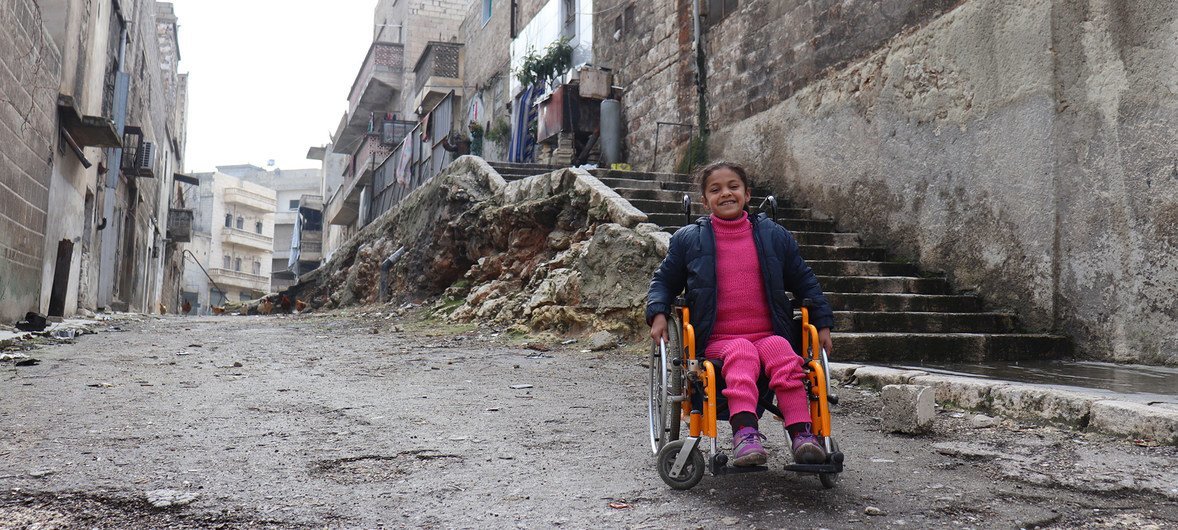 Eight-year-old Hanaa, who was paralysed by an exploding bomb and lost the use of her legs, sits in her wheelchair near her home in East Aleppo City, Syria. (file)