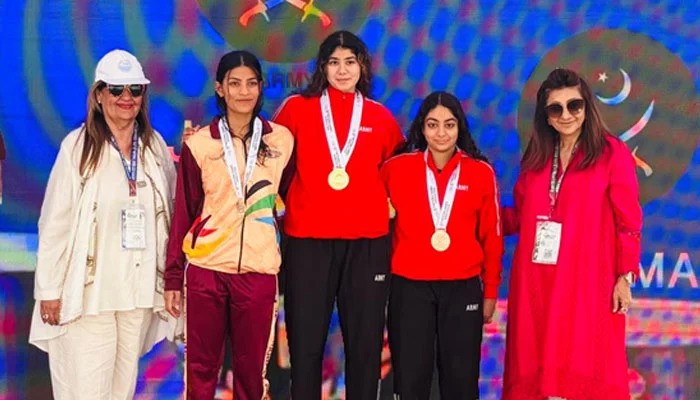 Pakistan Army's Jehanara Nabi (centre) poses for a picture after winning National Games gold medal in 400m individual medley in Karachi Pakistan Army's Jehanara Nabi (centre) poses for a picture after winning 35th National Games gold medal in 400m individual medley in Karachi